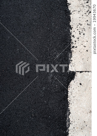 New asphalt concrete near the concrete kerb 19943670