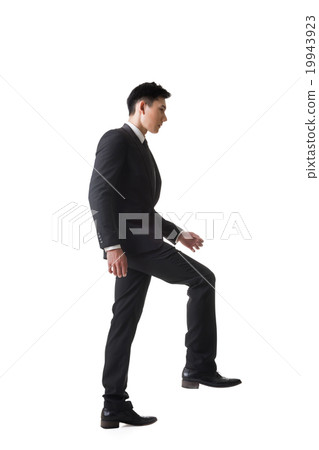 businessman walking up on stairs 19943923