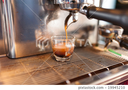 Prepares coffee with the coffee machine 19945210