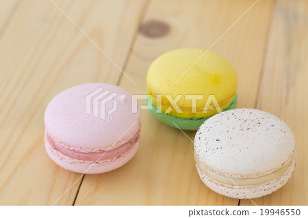 Colorful Macaroons boxset on wooden background. 19946550