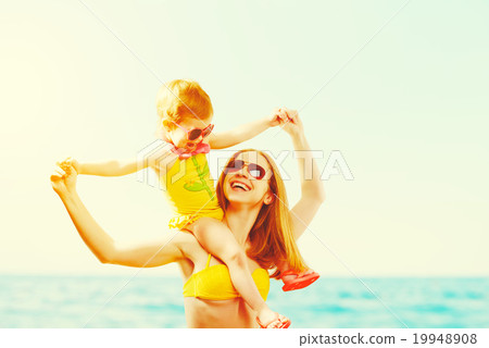 happy family on the beach. mother and child daughter 19948908