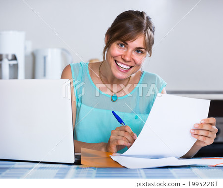 adult girl applying for bank loan at home adult girl applying for bank loan at home 19952281
