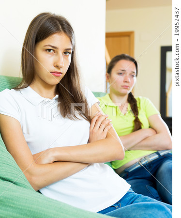 Sad young women looking away Sad young women looking away 19952437