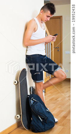 Teenager burying in mobile phone 19952438