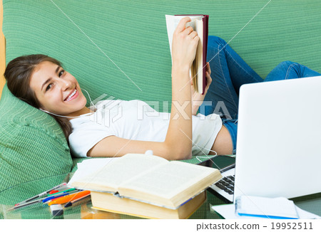 Teenager girl doing homework 19952511