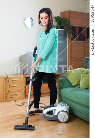 Woman cleaning with vacuum cleaner 19952547