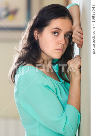 Depressed crying woman at home Depressed crying woman at home 19952548