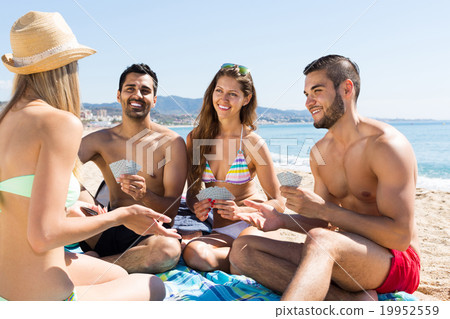 Group of people playing cards 19952559