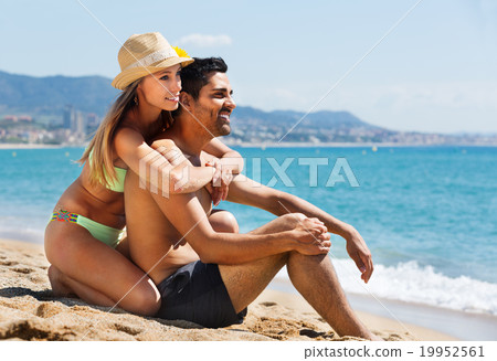 Young couple at sea shore 19952561