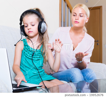 daughter using laptop instead of studying daughter using laptop instead of studying 19952676