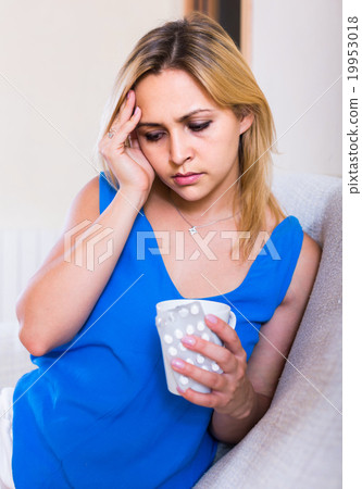 emale with antibiotic and glass of water indoors emale with antibiotic and glass of water indoors 19953018