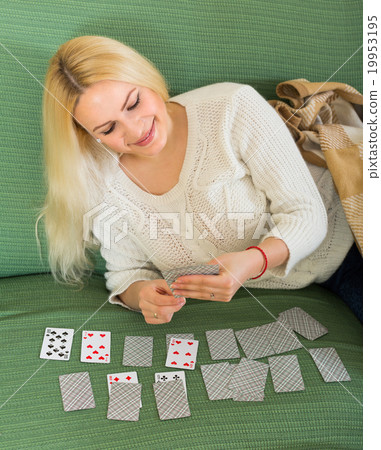 Woman with cards in home interior 19953195