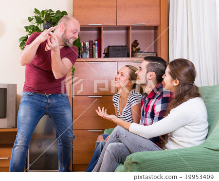 adults playing charades adults playing charades 19953409
