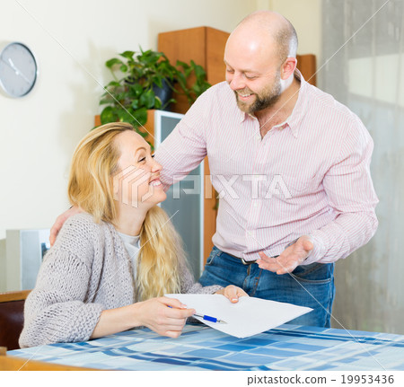 Couple with documents indoor 19953436