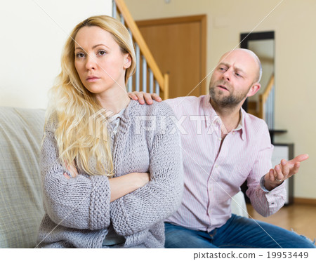 Couple having quarrel at home 19953449