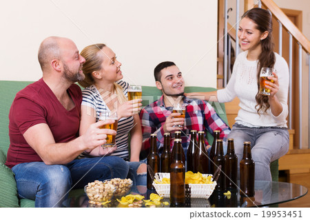 Two couples having fun at house party 19953451