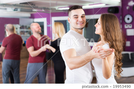 Couples enjoying of partner dance Couples enjoying of partner dance 19953490