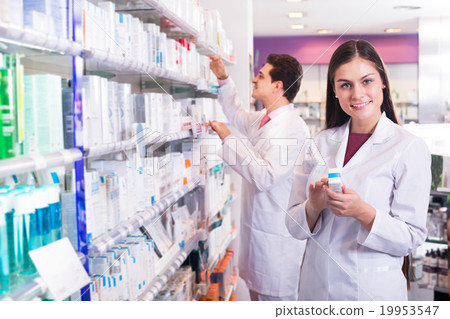 Young team in chemist shop Young team in chemist shop 19953547