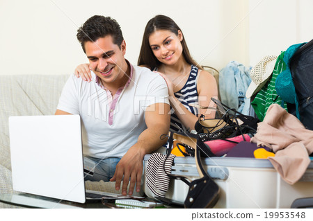 Couple with notebook and credit card. Couple with notebook and credit card. 19953548