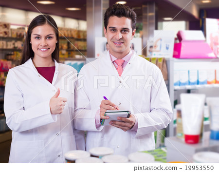 team of pharmaceutist and technician working in chemist shop team of pharmaceutist and technician working in chemist shop 19953550