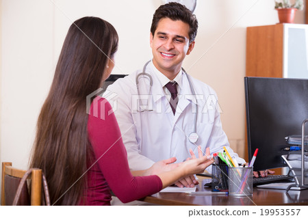 doctor receiving ill patient 19953557