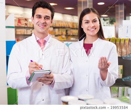 Young team in chemist shop 19953584