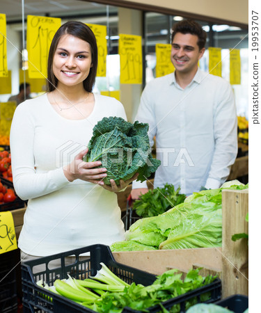 Couple buying vegetables Couple buying vegetables 19953707