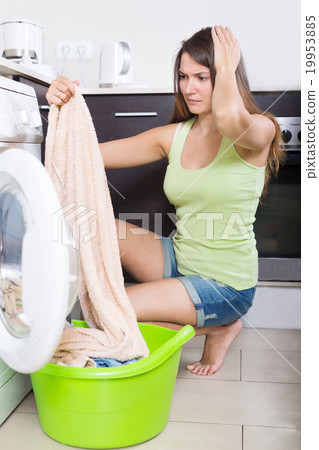 tired woman doing laundry tired woman doing laundry 19953885