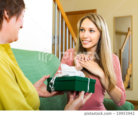 woman with a gift for girl woman with a gift for girl 19953942