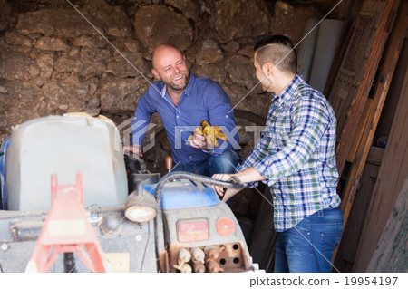 Two drivers working with tractor Two drivers working with tractor 19954197