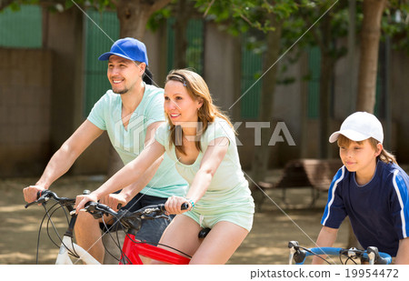 parents with son spending a weekend with bicycles parents with son spending a weekend with bicycles 19954472