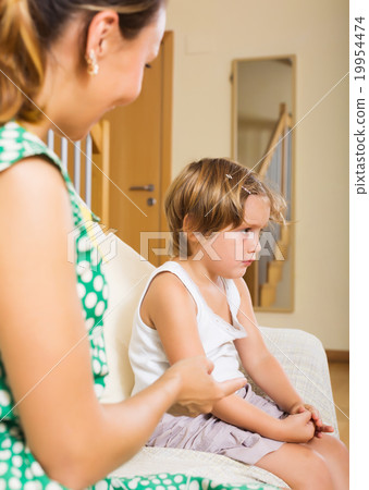 Woman berating little daughter Woman berating little daughter 19954474
