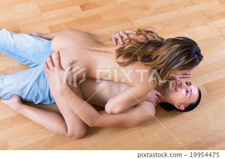 Woman and man making love indoor 19954475