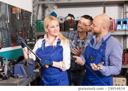 Auto mechanics at workshop 19954634