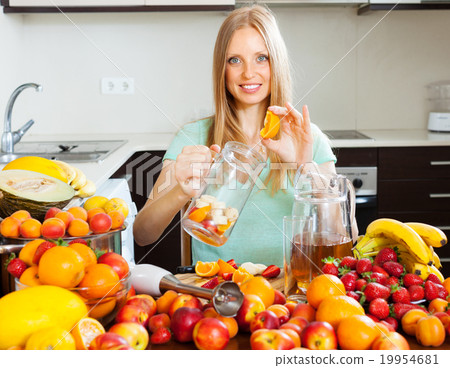 woman making fresh beverages from fruits 19954681