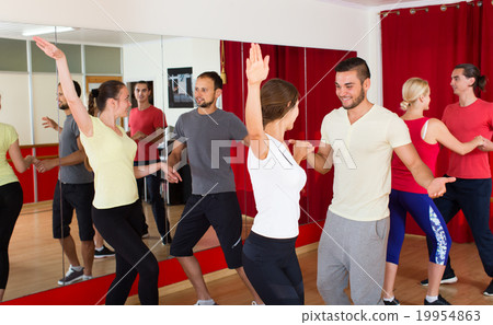 Men and women enjoying active dance Men and women enjoying active dance 19954863