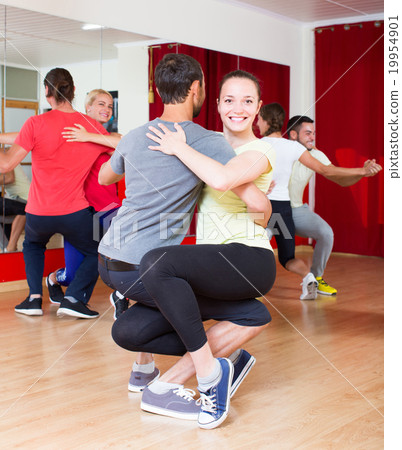 Group of people dancing salsa in studio 19954901