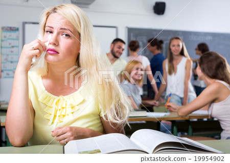 Blonde crying over a textbook Blonde crying over a textbook 19954902
