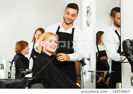 Girl cuts hair at the hair salon Girl cuts hair at the hair salon 19954967