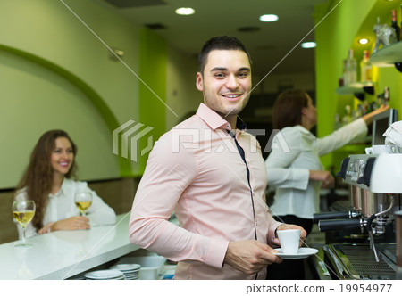 Bartender and barista working at bar 19954977