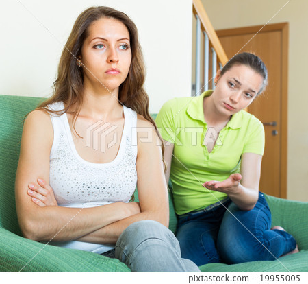 Two young women having quarrel 19955005