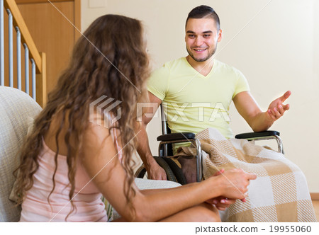 man in wheelchair and girl having conversation man in wheelchair and girl having conversation 19955060