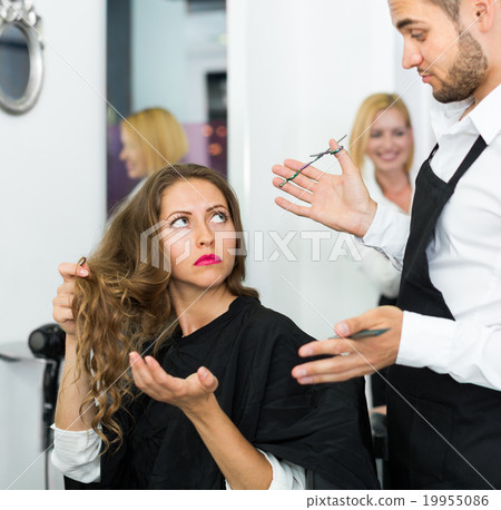 Haircutter quarrels with the client Haircutter quarrels with the client 19955086