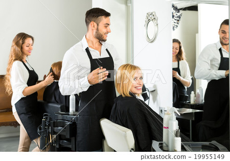Male hairdresser making haircut Male hairdresser making haircut 19955149