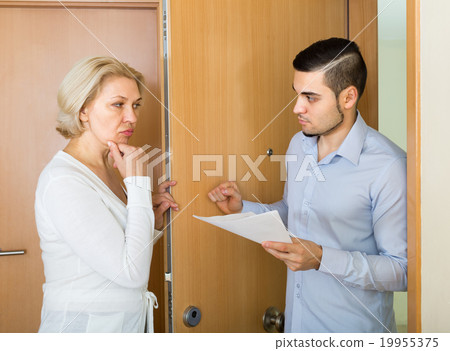 Collector and housewife near the door 19955375