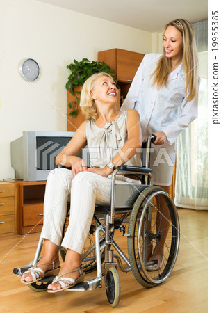 Physician and disabled female communicating Physician and disabled female communicating 19955385