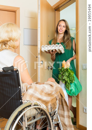 Female bringing food to invalid Female bringing food to invalid 19955494