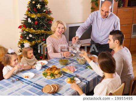 United family at festive table 19955495