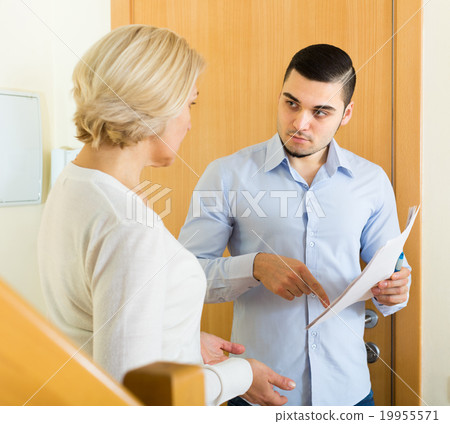 Collector and housewife near the door 19955571