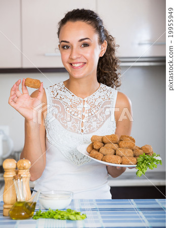 woman posing with plate of deep-fried kroketten 19955949